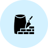 A black and white icon of a brick wall with a bag.