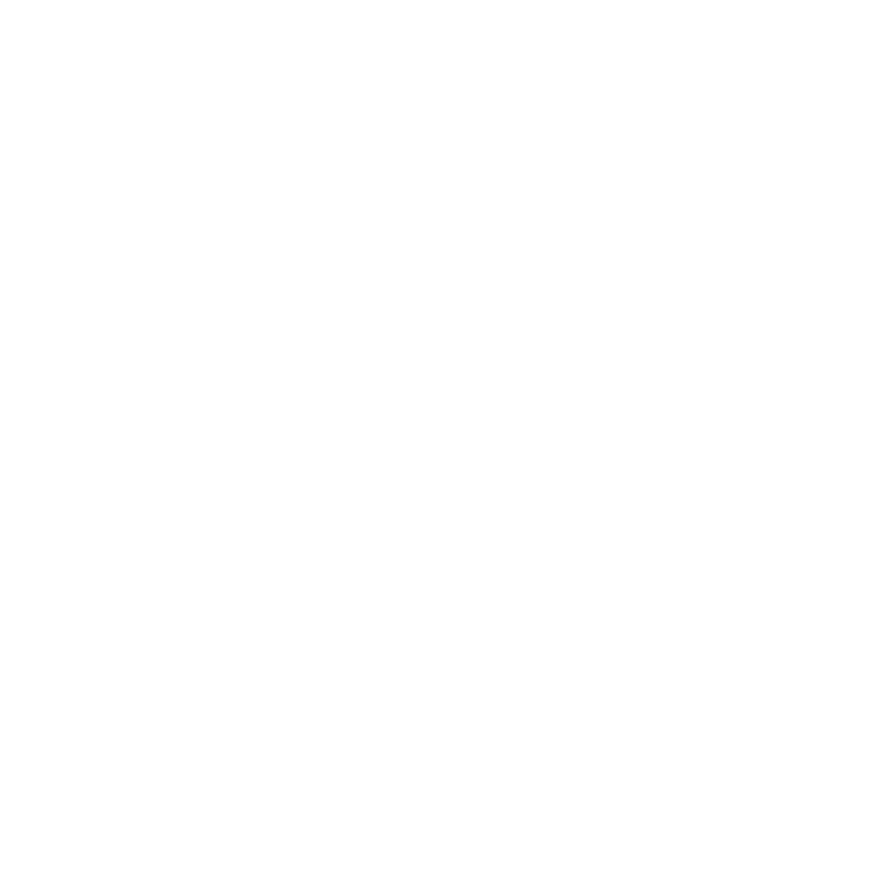 A white truck with a cement mixer on it's side.